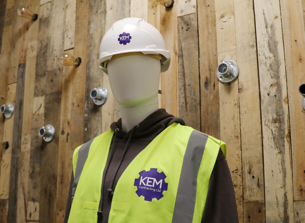 Hi-vis clothing and hard hat safety ware customised with vinyl